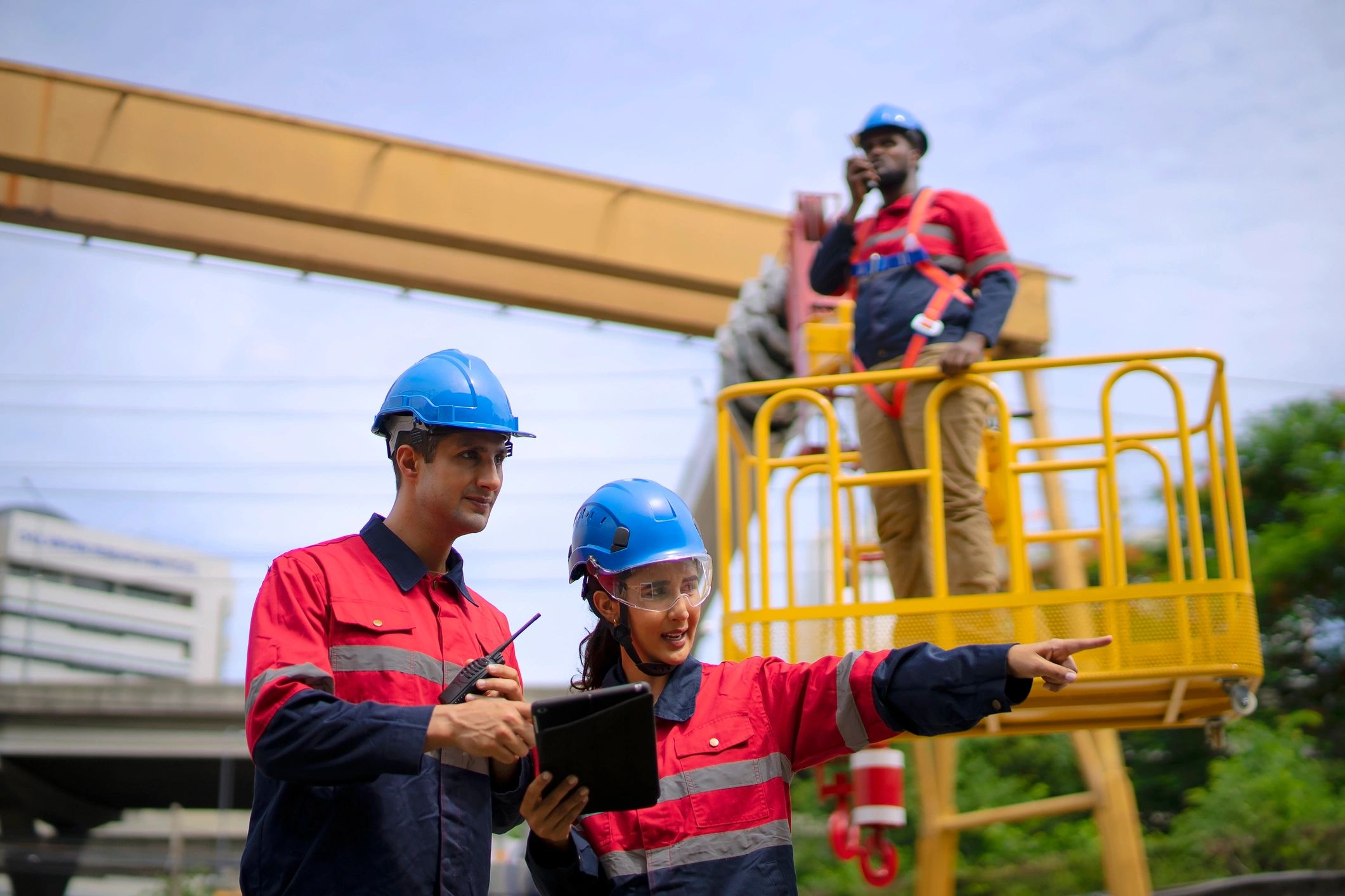 Engineers collaborating at an active construction site